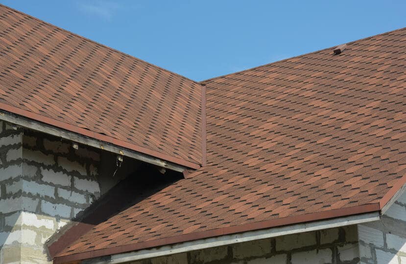 roof flashing repair-various types of roof flashing on a brown shingled roof