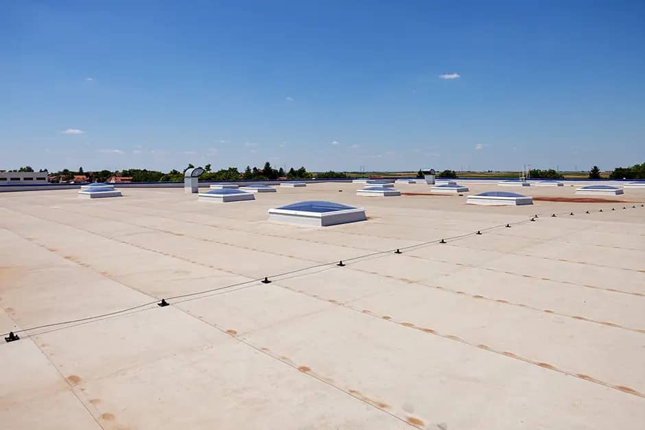 commercial roof replacement and blue sky