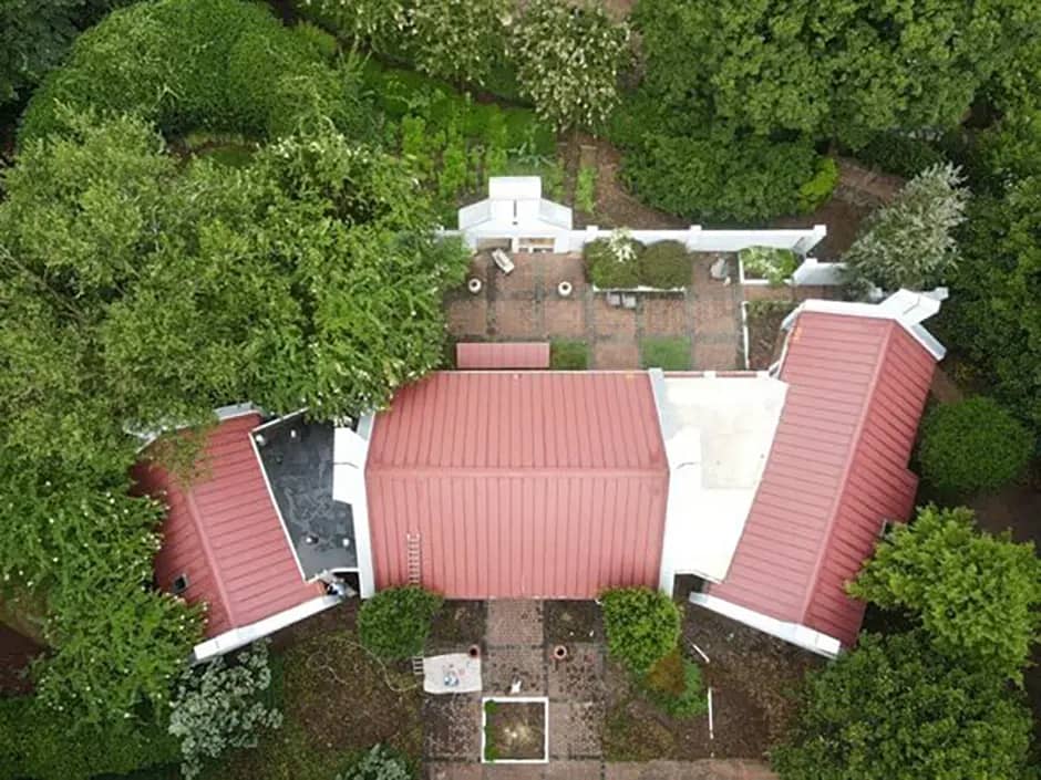 red standing seam metal roofing project