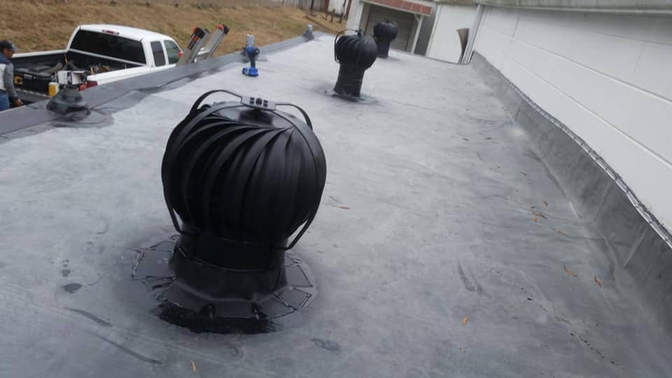 flat roofing with turbine roof ventilator