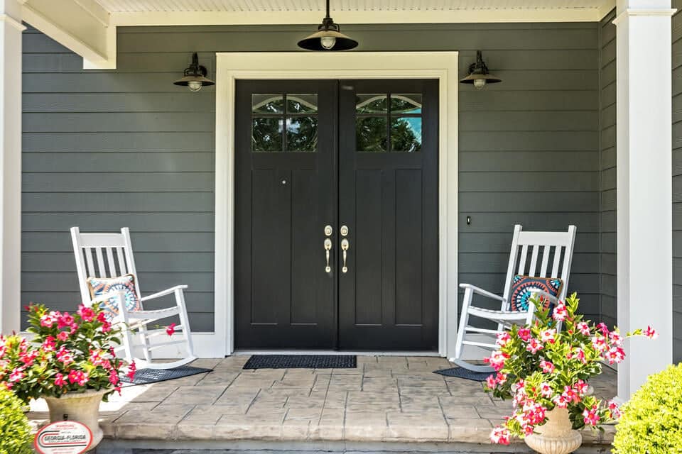 black front door-double black front door on a gray sided house