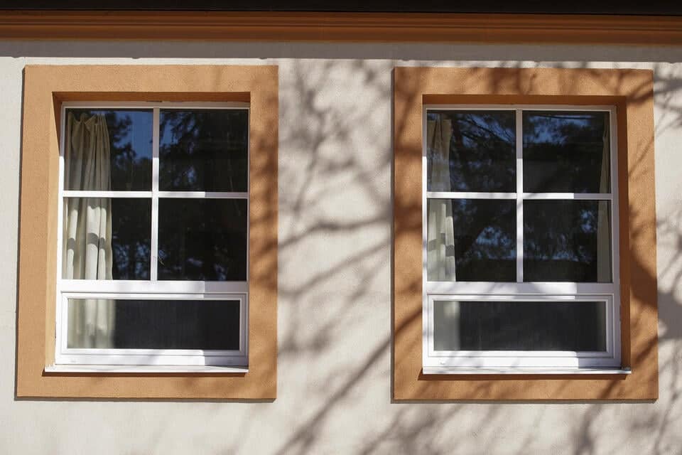 window casing-home exterior with brown window casing and trim