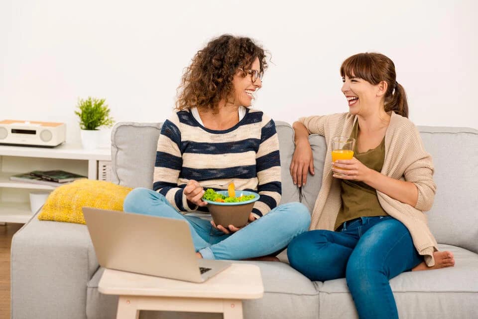 what-is-central-air-friends-sitting-on-couch-eating-and-drinking