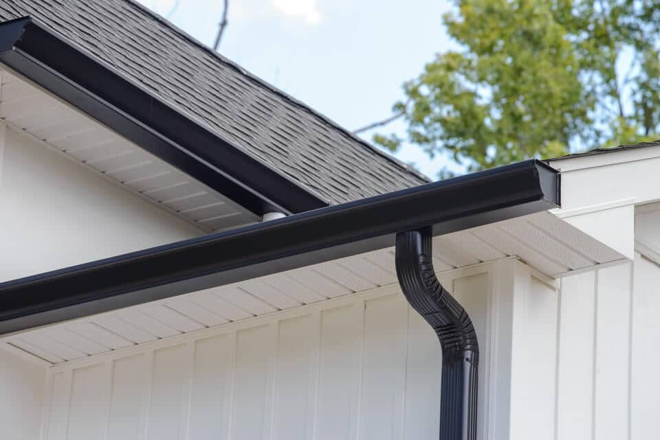 gutter colors-black gutters on white sided house