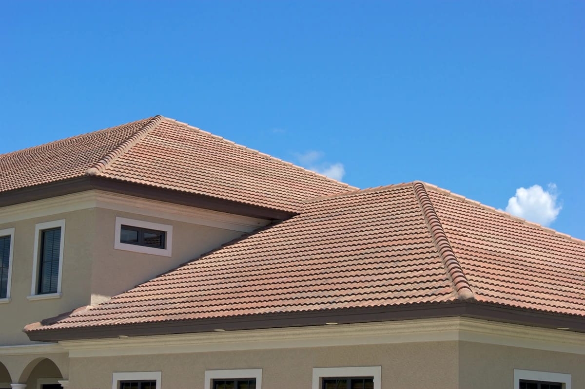 roof tops with clay tiles against blue sky