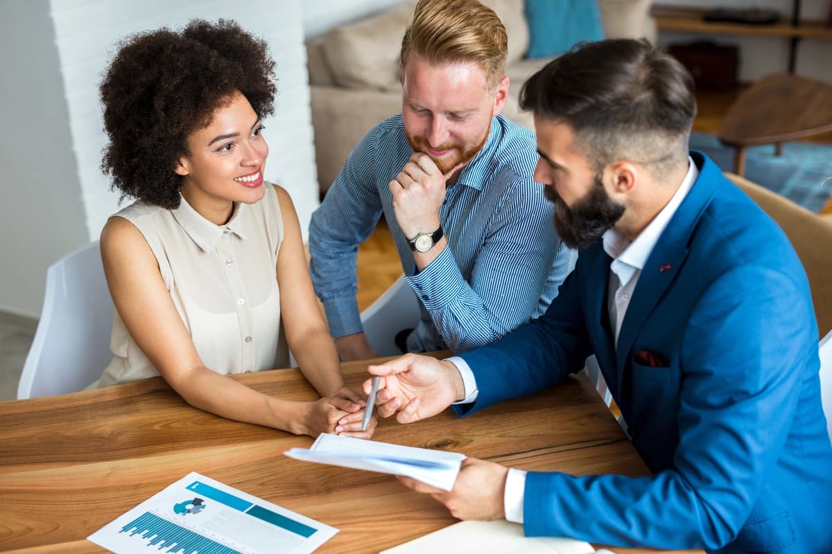 consultant and the couple having a meeting