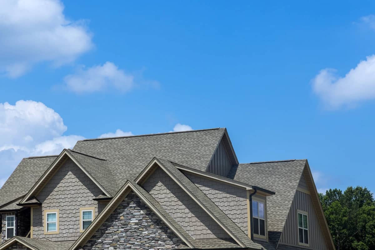 large family house with asphalt shingle roof