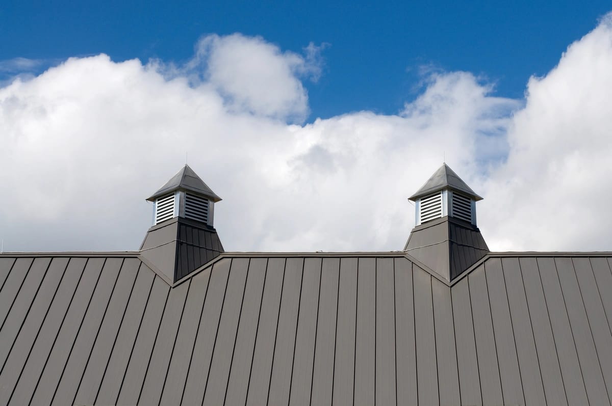 house roof with vents on against sky