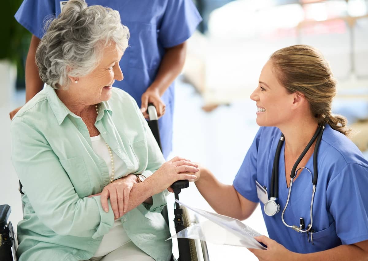 a care giver showing a gesture of care towards a person, mapleton